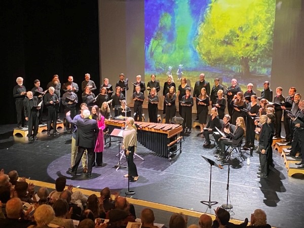 The Ars Nova Singers on stage before a full audience